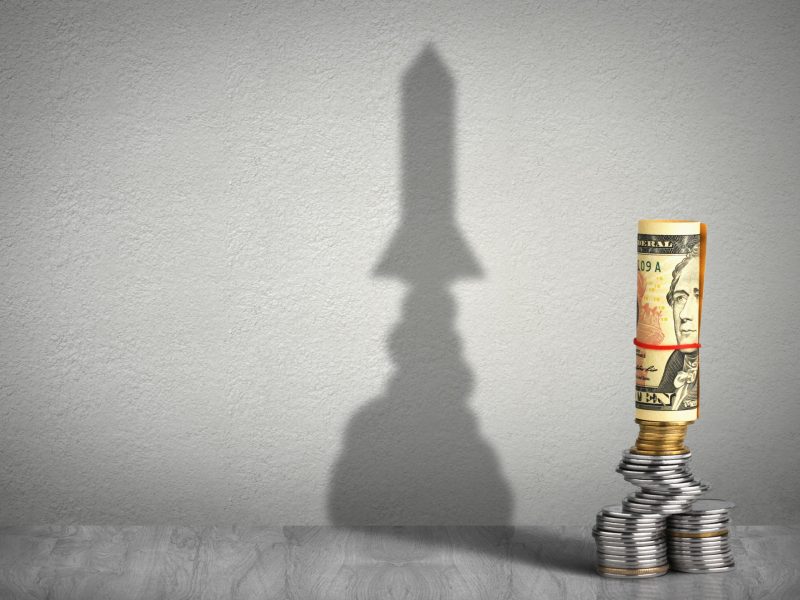 financial growth concept, money with rocket shadow